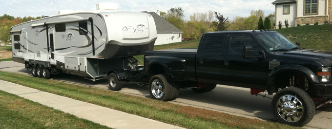 one ton lifted truck towing the automated safety hitch system